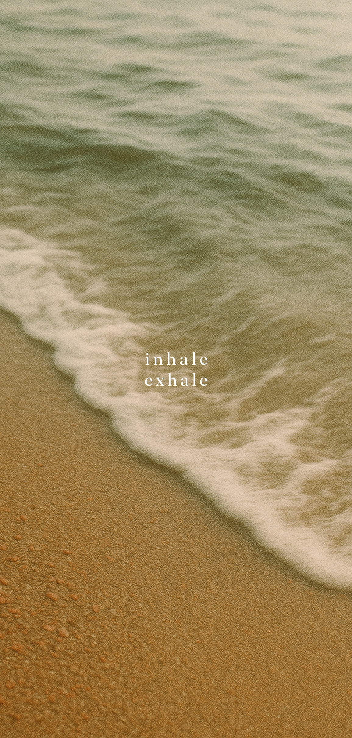 Mindful breathing wallpaper for June with ocean waves and the words “inhale / exhale”